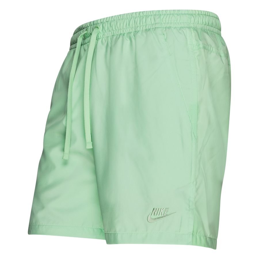 green nike woven shorts